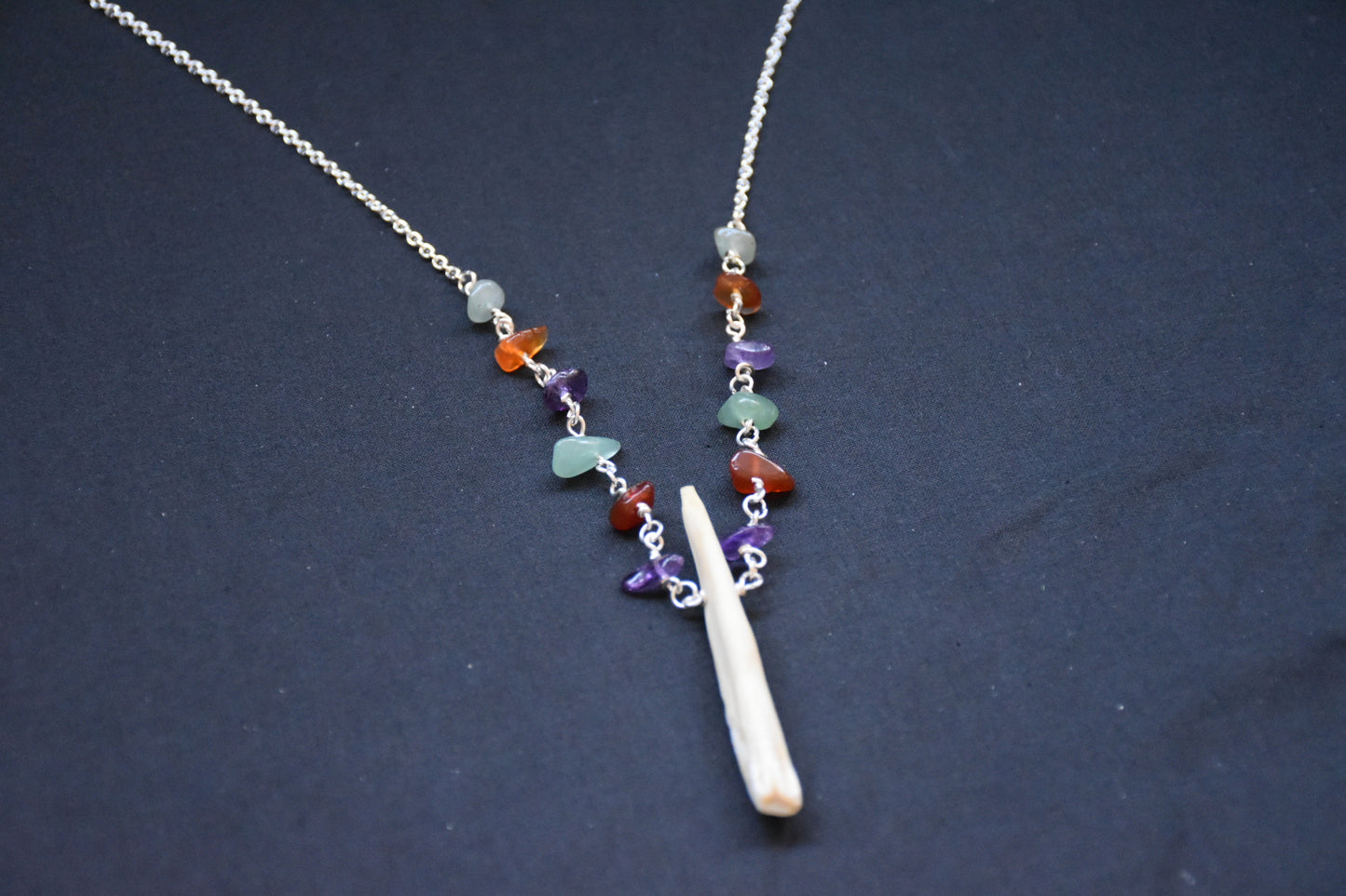 Crystal boar tusk necklaces