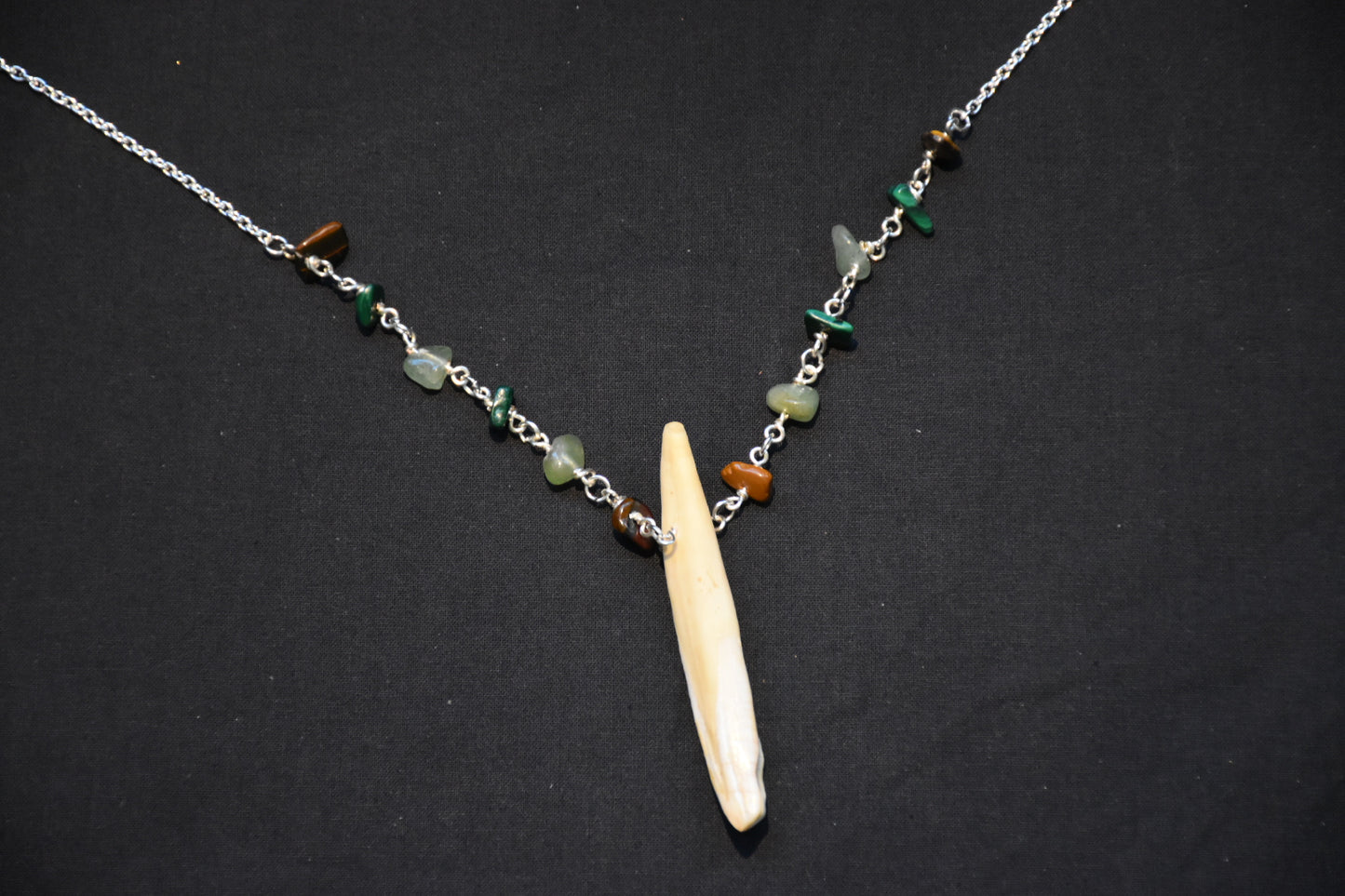 Crystal boar tusk necklaces