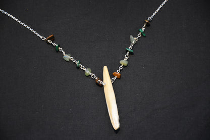 Crystal boar tusk necklaces