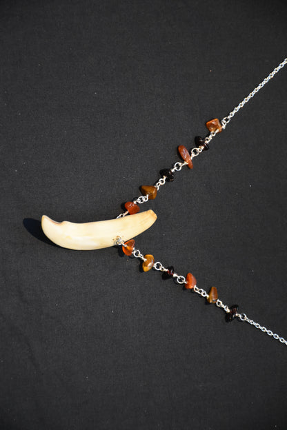 Crystal boar tusk necklaces