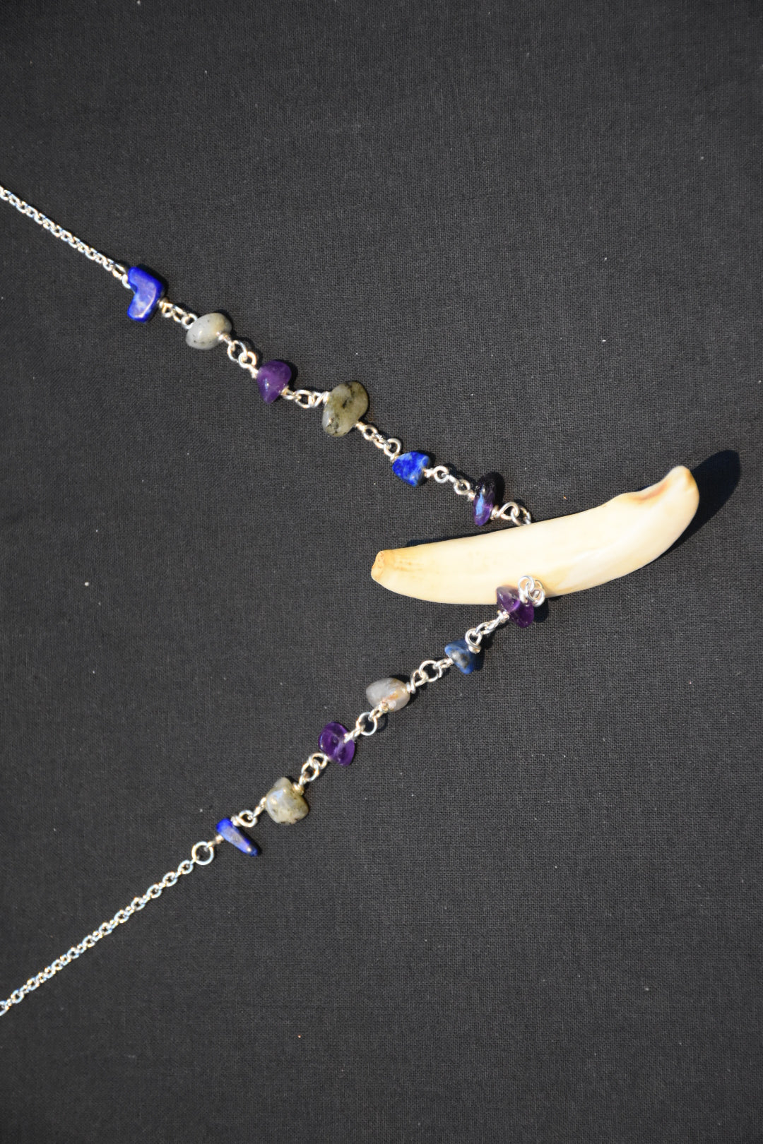Crystal boar tusk necklaces