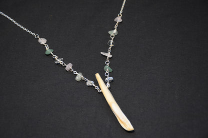Crystal boar tusk necklaces