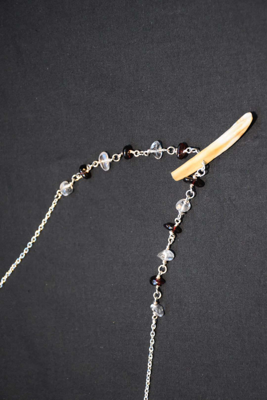 Crystal boar tusk necklaces