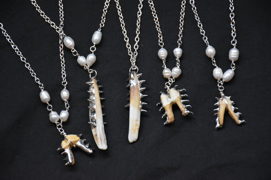 Armoured teeth necklaces