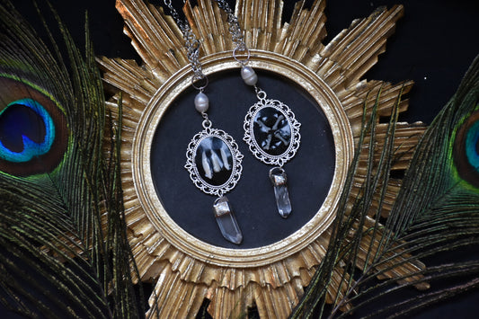 Black frame bone/tooth necklace clear quartz