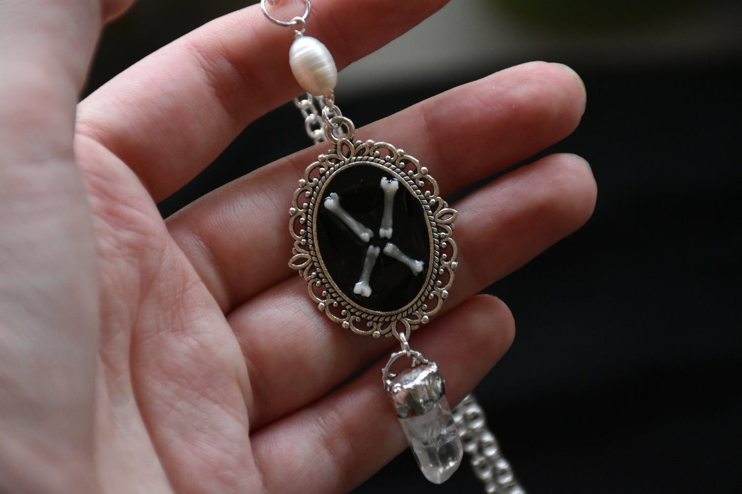 Black frame bone/tooth necklace clear quartz