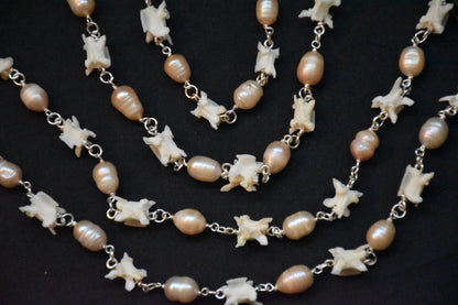 Pink pearl snake necklaces