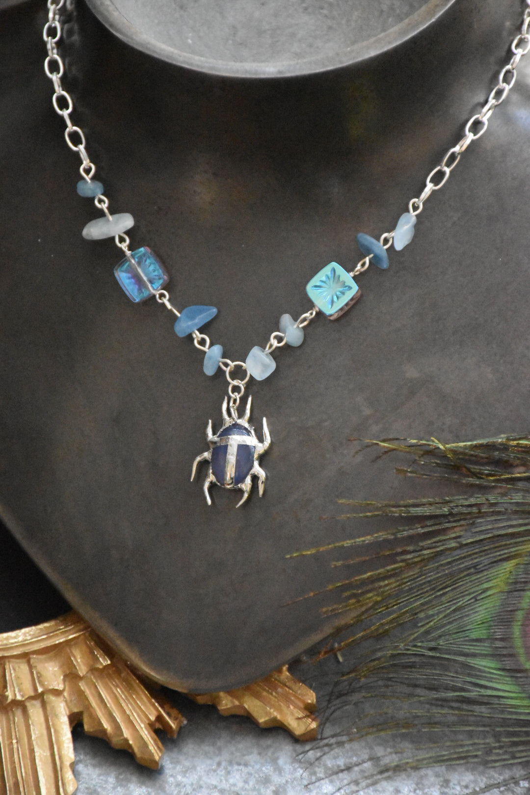 blue crystal beetle necklace