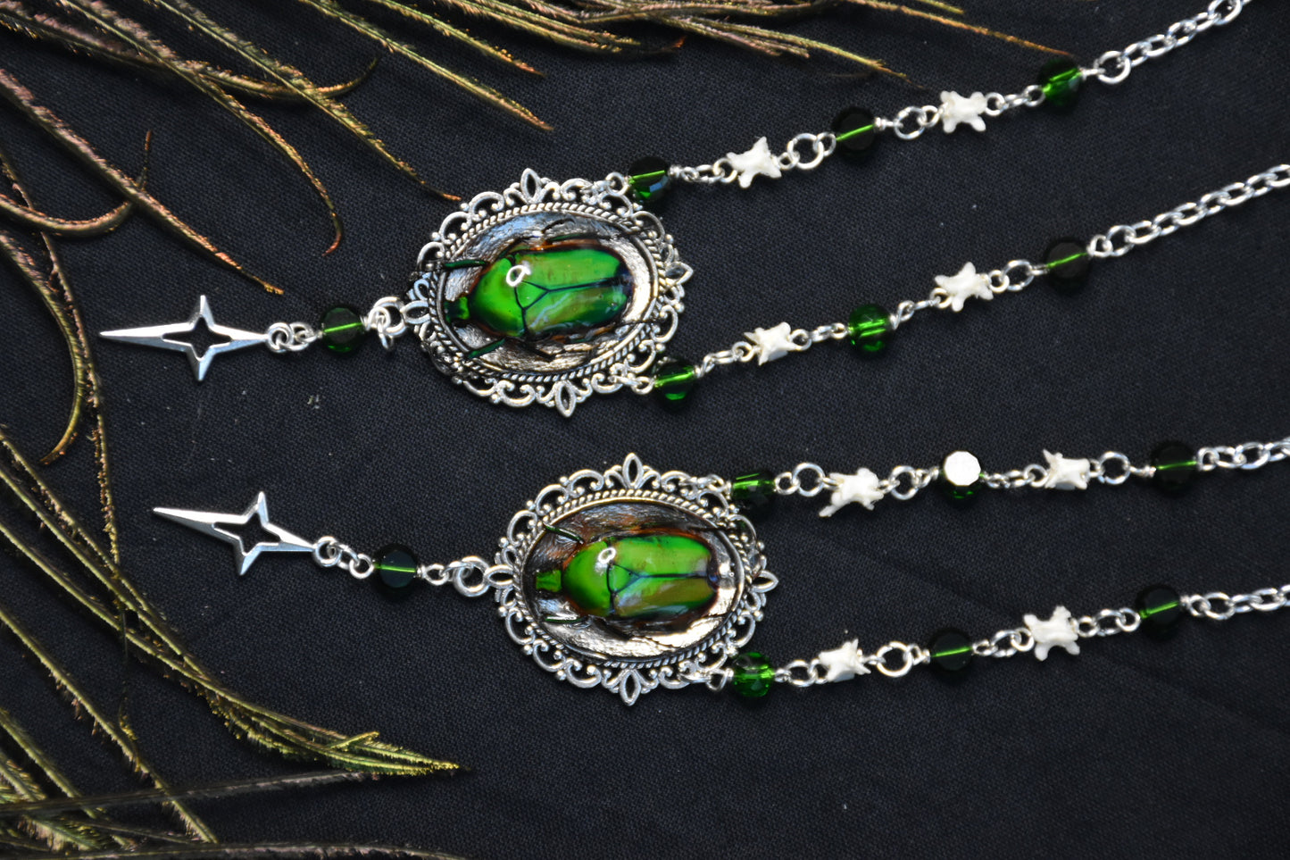 Snake bone beetle necklaces