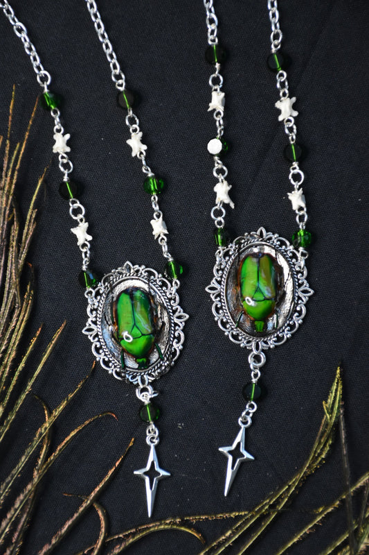 Snake bone beetle necklaces