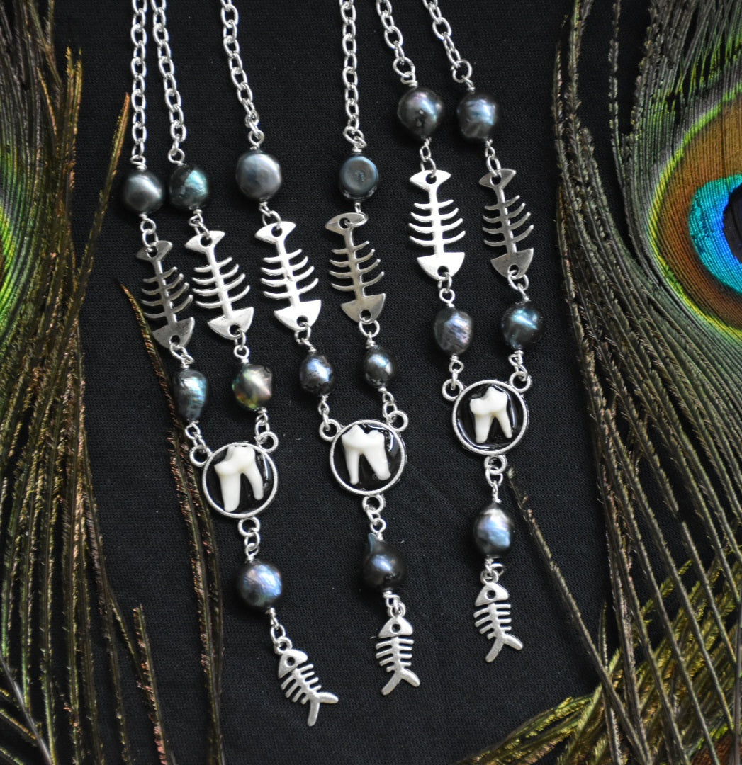 fox tooth fish necklaces