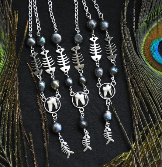 fox tooth fish necklaces