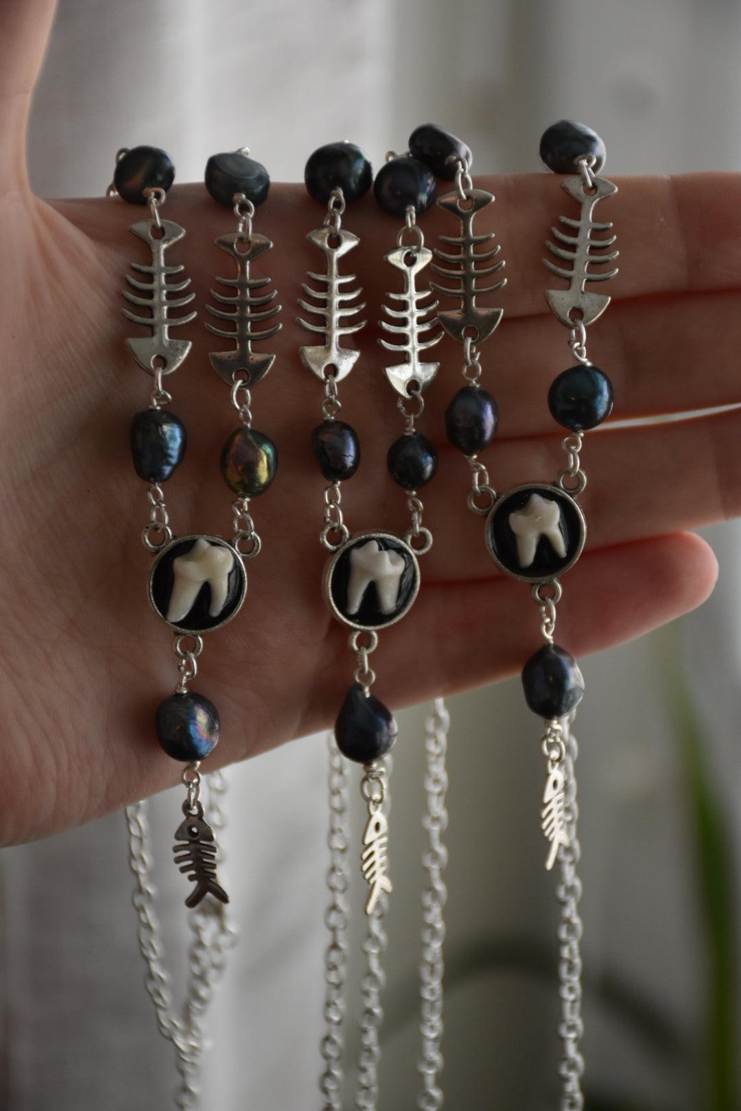 fox tooth fish necklaces
