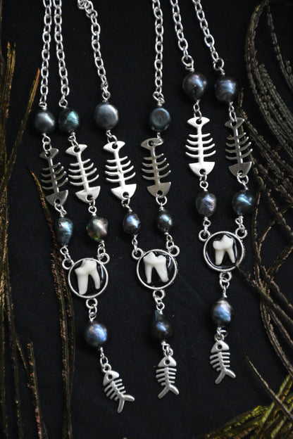 fox tooth fish necklaces